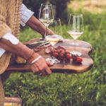 Women At An Outdoor Party Having Fun And Toasting Wine